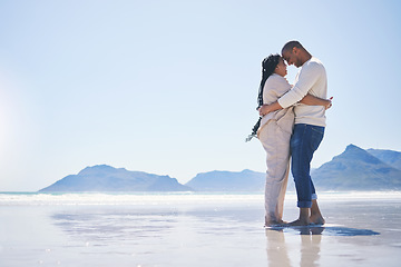 Image showing Love, hug and mockup with a couple on the beach for romance, dating or summer vacation together. Travel, ocean or view with a man and woman hugging while standing together on a coastal seashore