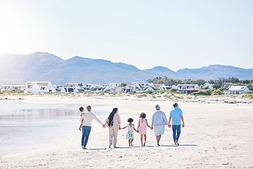 Image showing Family, holding hands and walk at beach with mockup space by water, together or bond with love in summer holiday. Men, women and children for support, vacation or ocean mock up with waves in sunshine
