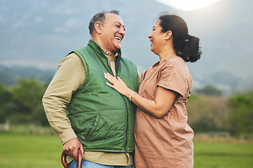 Image showing Nature, laughing and senior couple outdoor in with love, care and commitment to happy partner. Elderly man and a woman on a grass field or countryside for travel, adventure and retirement vacation