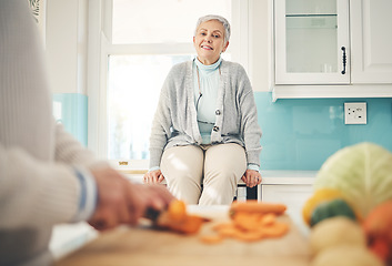 Image showing Cooking, food and a senior couple in the kitchen of their home together during retirement for meal preparation. Health, wellness or nutrition with a mature man and woman making supper in their house