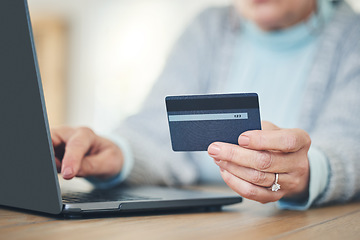 Image showing Laptop, credit card and hands typing for online shopping, digital banking or payment in home. Computer, ecommerce and woman on internet for sales, finance or fintech purchase, savings or investment.