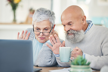 Image showing Laptop, elderly couple and wave on video call with coffee in home, talking and speaking in house. Computer, retirement and man and woman waving to say hello in virtual chat, online greeting and happy