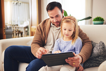 Image showing Child, dad and a tablet for learning in a family home while reading or playing a game for education. A man or father and girl kid on a sofa streaming internet, mobile app and website for development