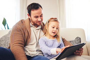 Image showing Family, father and a child with a tablet for learning at home while playing a game for education on internet. A man or dad and girl kid on sofa for streaming, mobile app and website for development