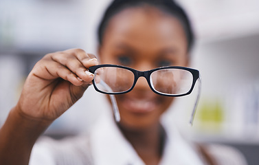 Image showing Vision, eye care and woman with glasses hand, clinic for eye exam and help for poor sight with health and wellness. Eyesight, wellness and girl holding designer brand frame and lens for healthy eyes.