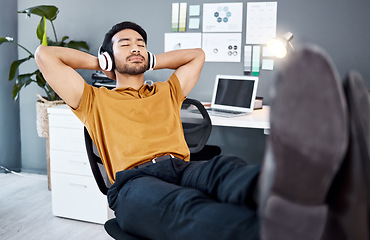 Image showing Business office, relax music and man finished with task, listening to calm podcast or radio audio sound. Streaming headphones, mental health and easy worker, employee or male agent done with work