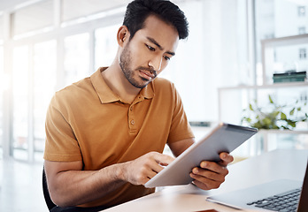 Image showing Business man, office and tablet with reading, planning and typing touchscreen for search, seo or web design. Asian businessman, mobile ux designer or focus at workplace with app, strategy and website