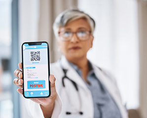 Image showing Woman doctor, phone and covid test results with QR code in hand ready for medical support. Clinic, hospital and positive result on digital healthcare and wellness app for safety and health care help