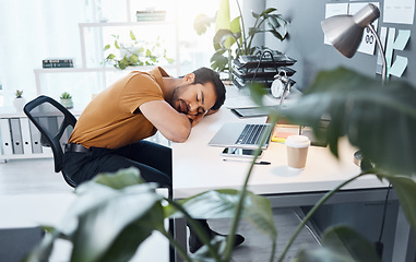 Image showing Business man, sleeping and tired at desk in office with burnout, exhausted and overworked at startup. Businessman, rest and sleep at job, workplace or company with fatigue at table for stress problem