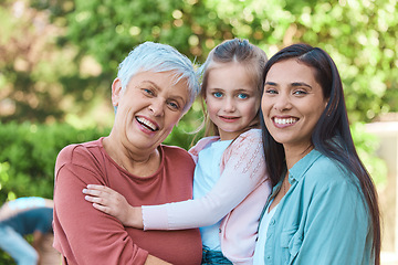 Image showing Family, women and portrait in a garden with love, hug and happy while bonding outdoors. Face, smile and girl with mother and grandmother in a park, embrace and enjoying the weekend outside together