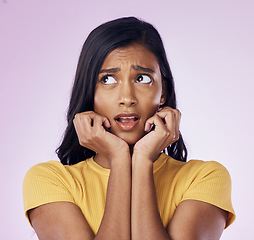 Image showing Scared, thinking and face of Indian woman on pink background with fear, nervous and confused expression. Stress, anxiety mockup and isolated female with worried, anxious and crisis reaction in studio