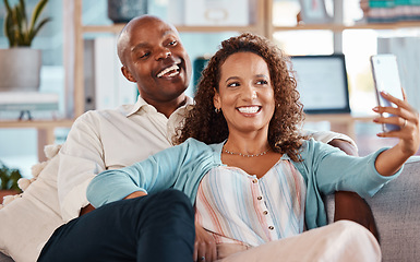 Image showing Selfie, happy and couple with smile on sofa for bonding, quality time and relaxing together at home. Marriage, happiness and interracial man and woman take picture for social media, memory and post