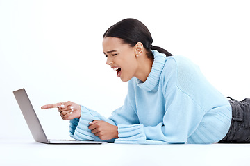 Image showing Laptop, angry woman and studio feeling frustrated, upset and stress from email scam. Isolated, white background and female with computer spam and 404 tech problem from phishing on the ground