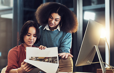 Image showing Creative business people, document and planning at night in collaboration, teamwork or idea at office. Happy employee women working late on project deadline, plan or paperwork in startup at workplace