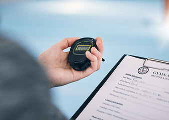 Image showing Hand, stopwatch and membership with a personal trainer in a gym, holding a sign up sheet during training. Fitness, sports and time with a coach using a watch during an exercise workout for health