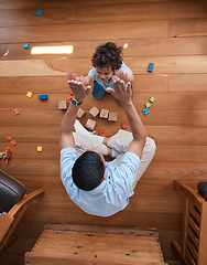 Image showing High five, toys and top view of father with baby on floor for playing, educational games and learning. Child development, family and above of happy dad and young boy for celebration, bonding and love