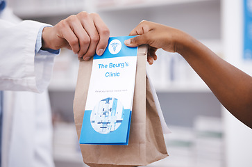 Image showing Clinic, medicine or pharmacist hands person a bag in drugstore with healthcare prescription receipt. Zoom, shopping or doctor giving customer products or pharmacy package for medical retail services