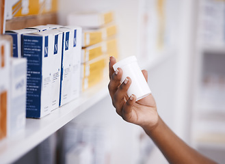 Image showing Shopping, medicine or hand of person with pills or supplements in drugstore for healthcare help. Zoom, pharmaceutical or customer checking or reading info on medical products or tablets in pharmacy