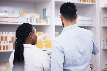 Image showing Man shopping, medicine or back of pharmacist in pharmacy for retail healthcare information or advice. Black woman or doctor helping a customer with prescription medication, pills or medical drugs