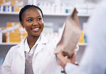 Image showing Black woman, medicine or pharmacist hands customer a bag in drugstore with healthcare prescription receipt. Shopping or happy African doctor giving patient pills or package in medical retail service