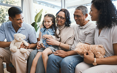 Image showing Love, children and teddy bear with a family in the living room on a sofa of their home together during a visit. Parents, grandparents and grandkids in the lounge of a house for bonding or relaxing