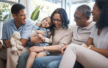 Image showing Big family, parents and girl with teddy bear on sofa, grandparents and tickle for game in home living room. Men, women and female child with toys, love and bonding on lounge couch in house on holiday