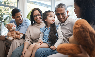 Image showing Parents, grandparents and girl with teddy bear on sofa, bonding and smile for family in home living room. Men, women and female child with toys, love and happiness on lounge couch in house on holiday