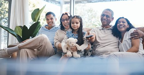 Image showing Happy family watching tv with parents, grandparents and child on sofa in living room, happiness and quality time together. Kid with teddy bear, women and men on couch to watch comedy movie with smile