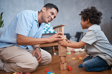 Image showing Education, building blocks or happy father with kid on floor for home playing, educational games and learning. Child development, family or dad and young boy together for fun lesson, bonding and love