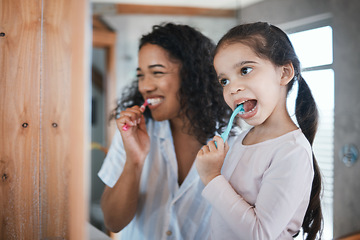 Image showing Brushing teeth, child and mom with dental cleaning and learning in a bathroom. Mother, kid and smile of wellbeing and wellness with happiness of health care and toothbrush in the morning at home