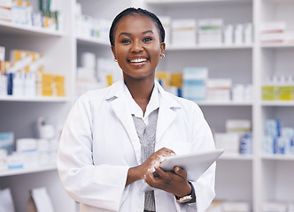 Image showing Portrait of black woman in pharmacy with tablet, smile and online inventory list for medicine on shelf. Happy female pharmacist, digital checklist and medical professional checking stock in store.