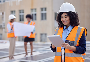 Image showing Solar panels, engineering and tablet with woman on roof for planning, renewable energy and leadership. Sustainability, technology and photovoltaic maintenance with female engineer for inspection