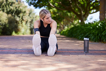 Image showing Fitness, legs and woman stretching before exercise, workout or training outdoors for health and wellness. Sport, healthy and female athlete or person ready to start for performance run or marathon