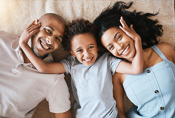 Image showing Portrait, family and top view smile in home, bonding or having fun together. Parents, happiness and child relaxing or lying on ground or carpet floor with man and woman, care or enjoying quality time