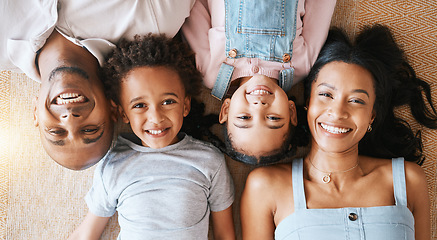 Image showing Family, portrait and top view smile in house, bonding or having fun together. Parents, happiness above and children relaxing or lying on carpet floor with man and woman, care or enjoying quality time