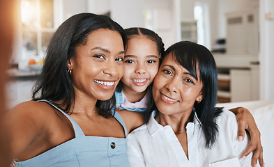 Image showing Grandmother, selfie and child with mother in home living room, bonding or having fun. Family, smile and portrait of girl with grandma and mom taking face pictures while enjoying quality time together