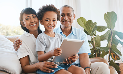 Image showing Portrait, grandparents and kid smile with tablet in home living room on sofa, bonding or having fun. Family, happiness and child with grandma and grandpa, care and enjoying time together in lounge.