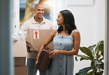 Image showing Happy couple, real estate and moving in new home with box for property investment or relocation together. Man and woman realtor carrying boxes or luggage in the house with smile for mortgage loan