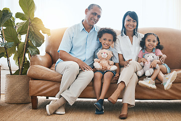 Image showing Grandparents, portrait and kids smile in home living room on sofa, bonding or having fun. Family, happiness and children with grandma and grandpa, care and enjoying time together with teddy bear.