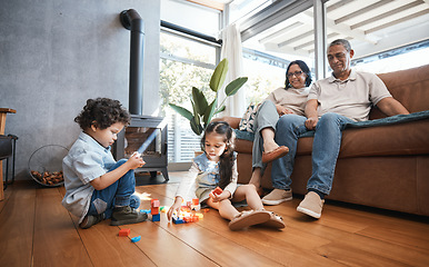 Image showing Grandparents, toys and children on floor playing for relaxing, educational game and learning. Child development, family home and happy grandpa, grandmother and kids for quality time, bonding and love