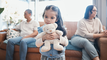 Image showing Divorce, mother and father with a sad girl, teddy bear and separation at home, living room and ignore. Parents, mama and dad with daughter, female child with a toy and family with issues and problems