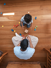 Image showing Building blocks, toys and top view of father with baby on floor for playing, educational games and learning. Child development, family home and above of dad and boy for creative fun, bonding and love