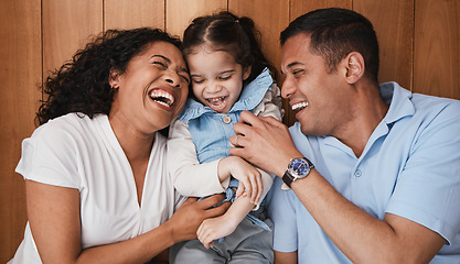 Image showing Happy, funny and family with girl, parents and laughing with happiness, bonding and loving. Love, mother, and father with daughter, smile and quality time with dad, mama and female child with humor