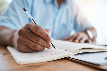 Image showing Man, hands and writing in book for finance, budget or schedule planning in remote work at home. Closeup hand of male freelancer taking notes in diary for financial record, expenses or tasks on desk