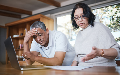 Image showing Mature couple, debt and stress of budget in home with anxiety, planning money and mortgage bills. Frustrated man, woman and overwhelmed with documents, taxes and financial crisis of inflation problem