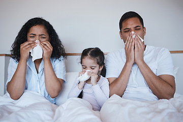 Image showing Family, sick and blowing nose in bedroom in home lying on bed together in house. Flu, parents and child wipe with tissue with man, woman and girl with covid, virus or cold, disease or winter allergy.