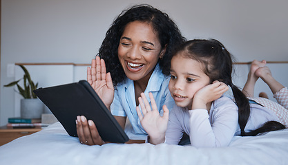 Image showing Tablet, mother and girl wave in video call on bed in home bedroom, talking or speaking. Technology, happiness and mom and child in virtual chat, online conversation and waving while live streaming.