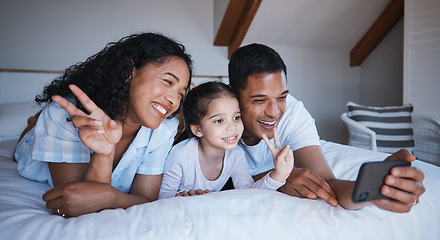 Image showing Family, smile and peace sign selfie in bedroom, bonding or having fun together on bed. Hand gesture, happiness or kid, mother and father taking photo for social media, happy memory or profile picture