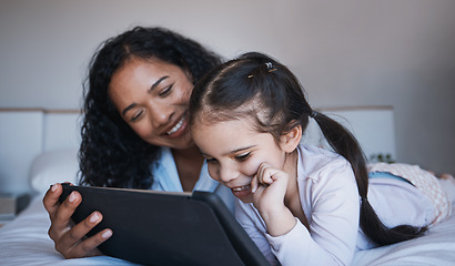 Image showing Mother, tablet and kid relax on bed in home bedroom, social media or online browsing. Technology, happiness and mom and girl with touchscreen for learning, streaming film or video together in house