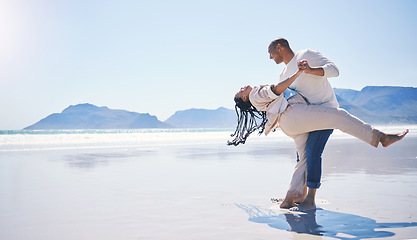 Image showing Couple, beach and dance with happiness by space for mockup with sunshine, summer and holiday with love. Man, woman and dancing with smile, romance and sky mock up by ocean with bonding on vacation